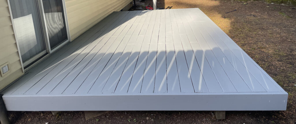 After: restored 10×20 deck with Sherwin-Williams SuperDeck coating, left-end view, Action Craftworks LLC, Vancouver WA