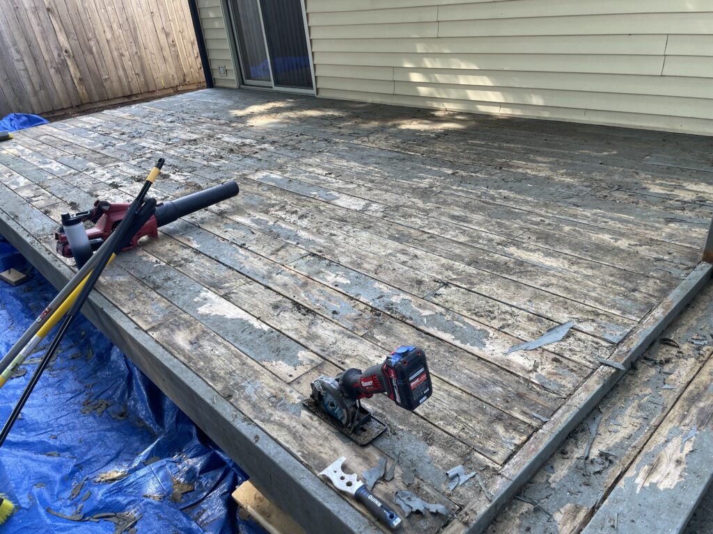 Deck restoration in progress: scraping and sanding old coating, Action Craftworks LLC, Vancouver WA