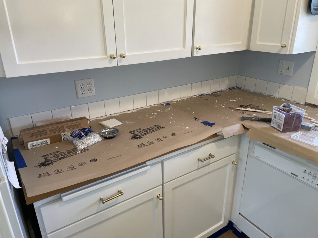 Installed 4 inch backsplash tile with white thinset and 1/16' grout joints