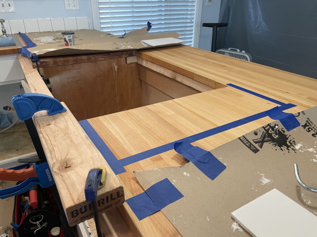 Preparing to rout recess for tile trivets into wood butcher block countertop