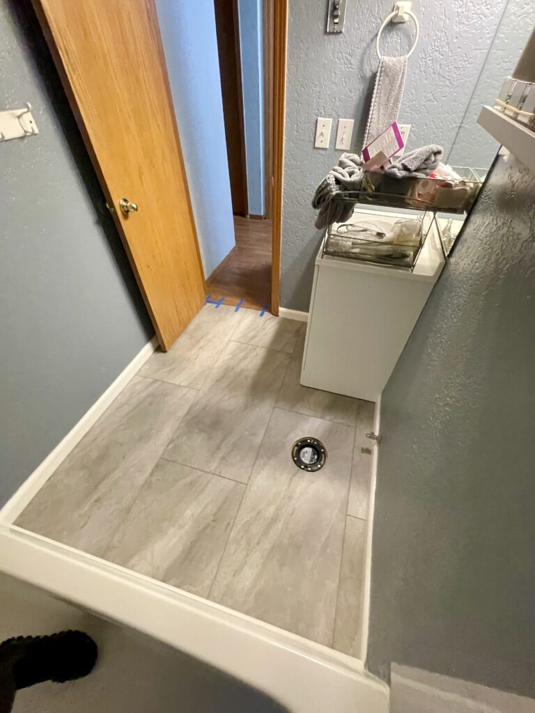 Bathroom remodel with new vinyl tile flooring by Action Craftworks LLC in Vancouver, WA