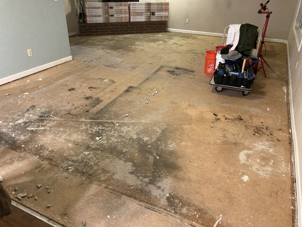 Carpet removed before luxury vinyl plank flooring renovation by Action Craftworks LLC in Vancouver, WA