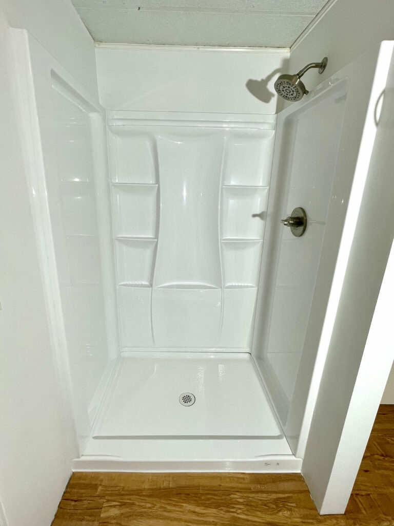 Full view of new shower base and surround by Action Craftworks LLC in LaCenter, WA