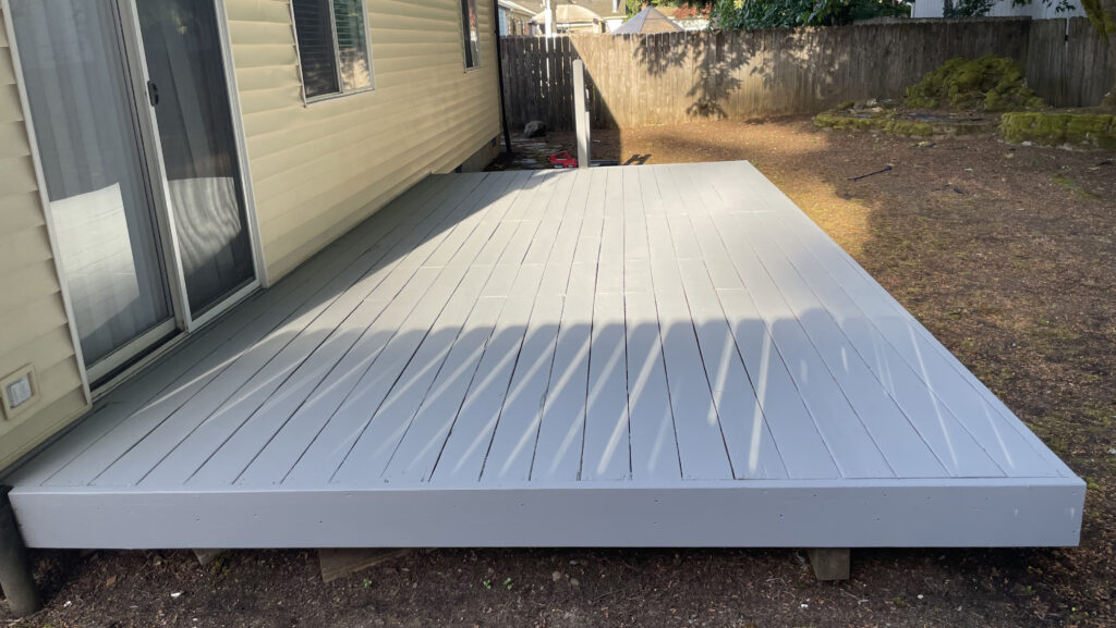 After: restored 10×20 deck with Sherwin-Williams SuperDeck coating, left-end view, Action Craftworks LLC, Vancouver WA