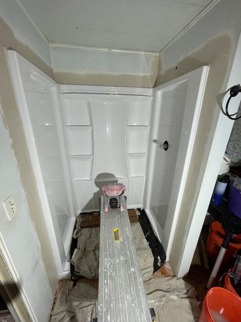 Drywall patched around new shower surround by Action Craftworks LLC in LaCenter, WA