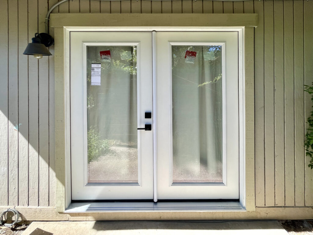 French doors replaced sliding glass doors at bedroom with Craftsman trim by Action Craftworks LLC in Vancouver WA