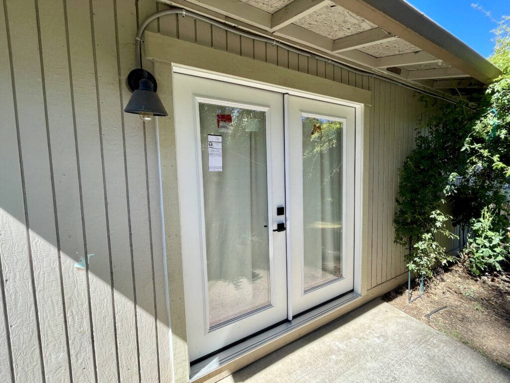 French doors replaced sliding glass doors at bedroom with Craftsman trim by Action Craftworks LLC in Vancouver WA, angle view
