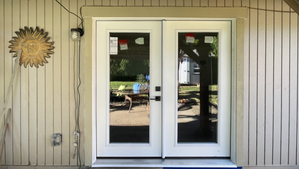 French doors replaced sliding glass doors at patio with Craftsman trim by Action Craftworks LLC in Vancouver WA, wide view