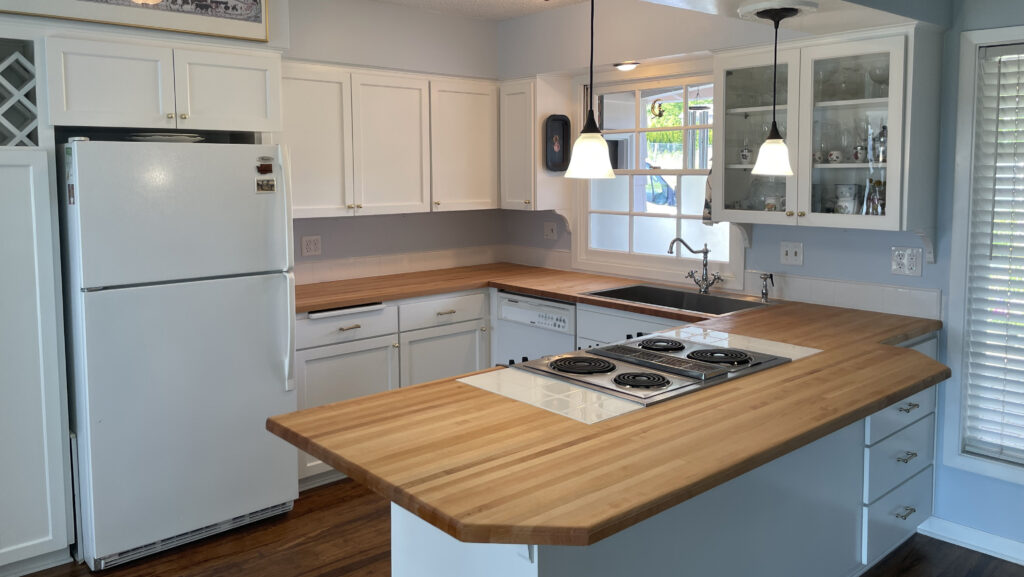 Kitchen remodel by Action Craftworks LLC in Vancouver WA, completed after painting cabinets and installing Big Leaf Maple sustainable butcher block wood countertops finished with Rubio Monocoat Oil Plus 2C Pure, wide view