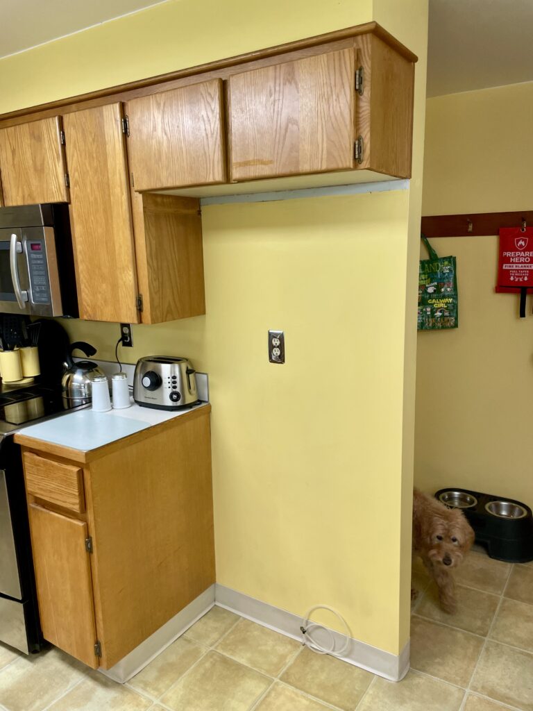 Kitchen cabinet renovation cut above new refrigerator by Action Craftworks LLC in Vancouver, WA