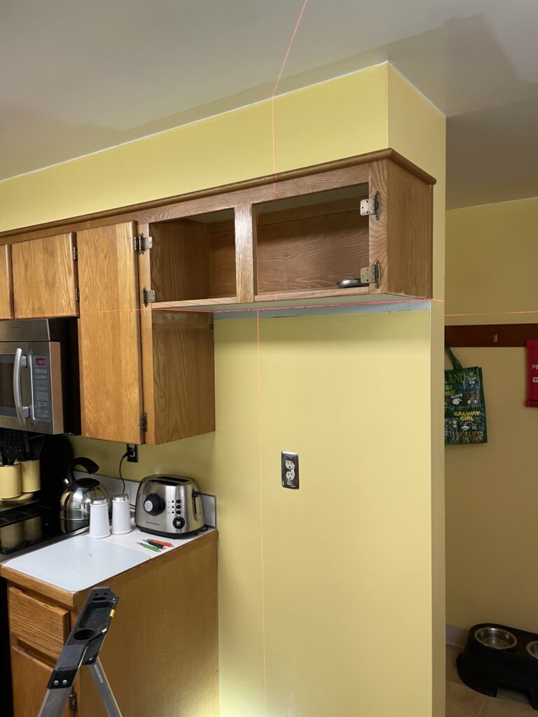 Kitchen cabinet renovation using a laser to mark the cut lines by Action Craftworks LLC in Vancouver, WA