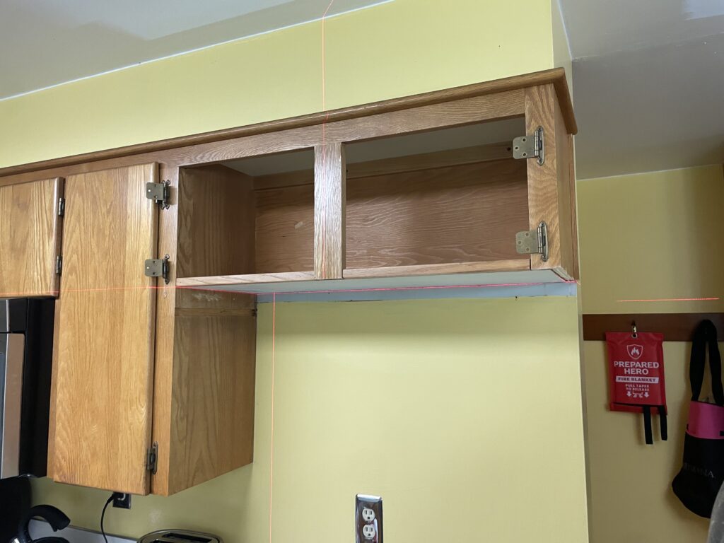 Kitchen cabinet renovation: raised the bottom shelf higher for new refrigerator by Action Craftworks LLC in Vancouver, WA