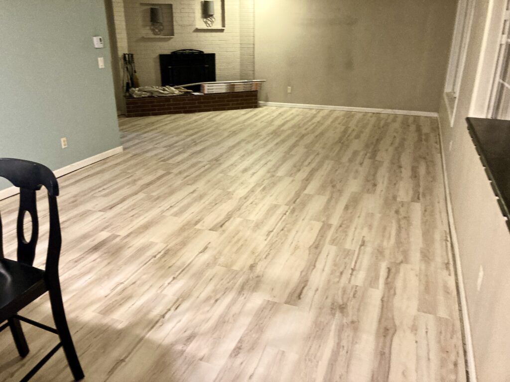 Living room whole house luxury vinyl plank flooring by Action Craftworks LLC in Vancouver, WA