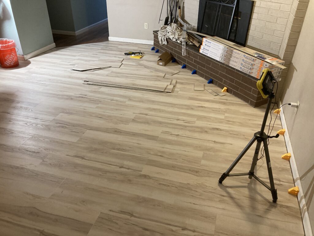 Luxury vinyl plank flooring in living room by Action Craftworks LLC in Vancouver, WA