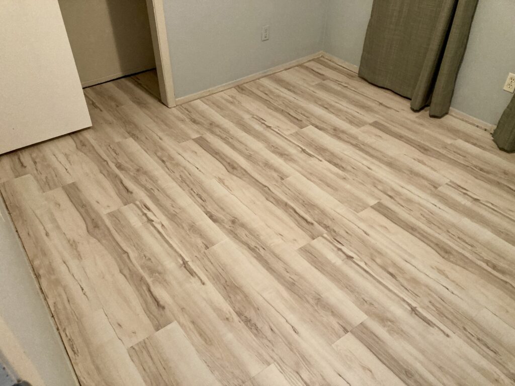 LVP flooring in bedroom by Action Craftworks LLC in Vancouver, WA