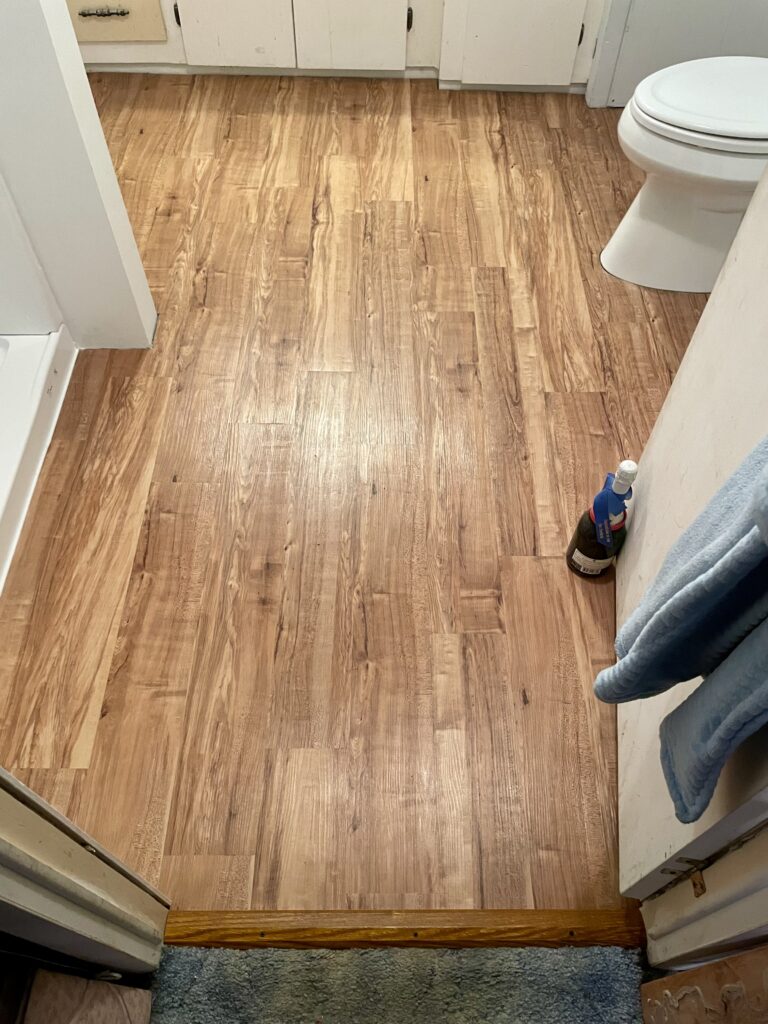 New LVP flooring in bathroom by Action Craftworks LLC in LaCenter, WA