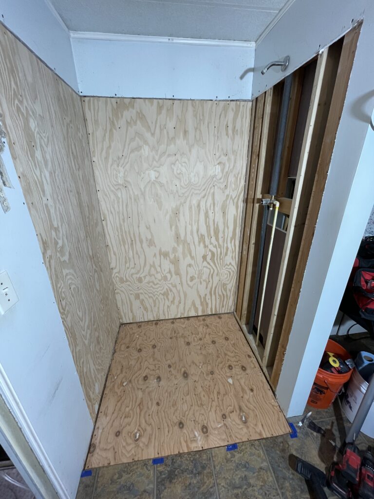Plywood walls and floor installed before new shower base and wall surrounds by Action Craftworks LLC in LaCenter, WA