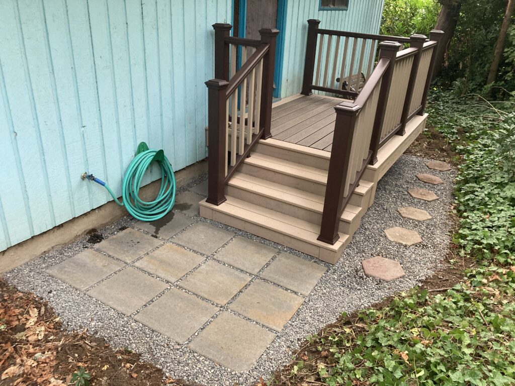 New concrete pavers and reused hexagon concrete pavers around porch deck rebuild by Action Craftworks LLC in Vancouver, WA