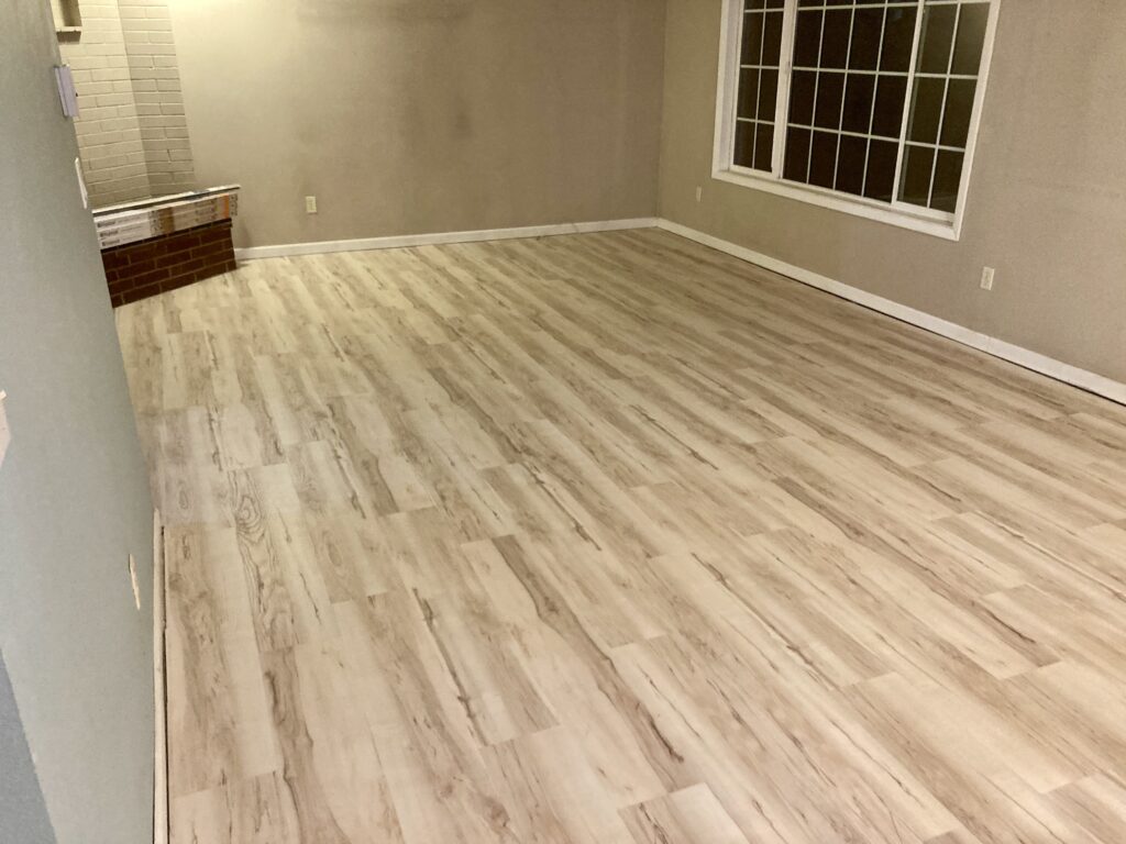 Whole house luxury vinyl plank flooring in living room by Action Craftworks LLC in Vancouver, WA